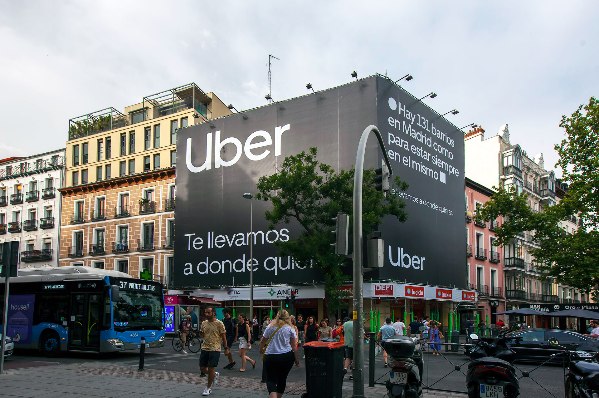 Curved LED billboard wrapping a Madrid building corner
